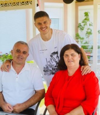 Milot Rashica with his parents.